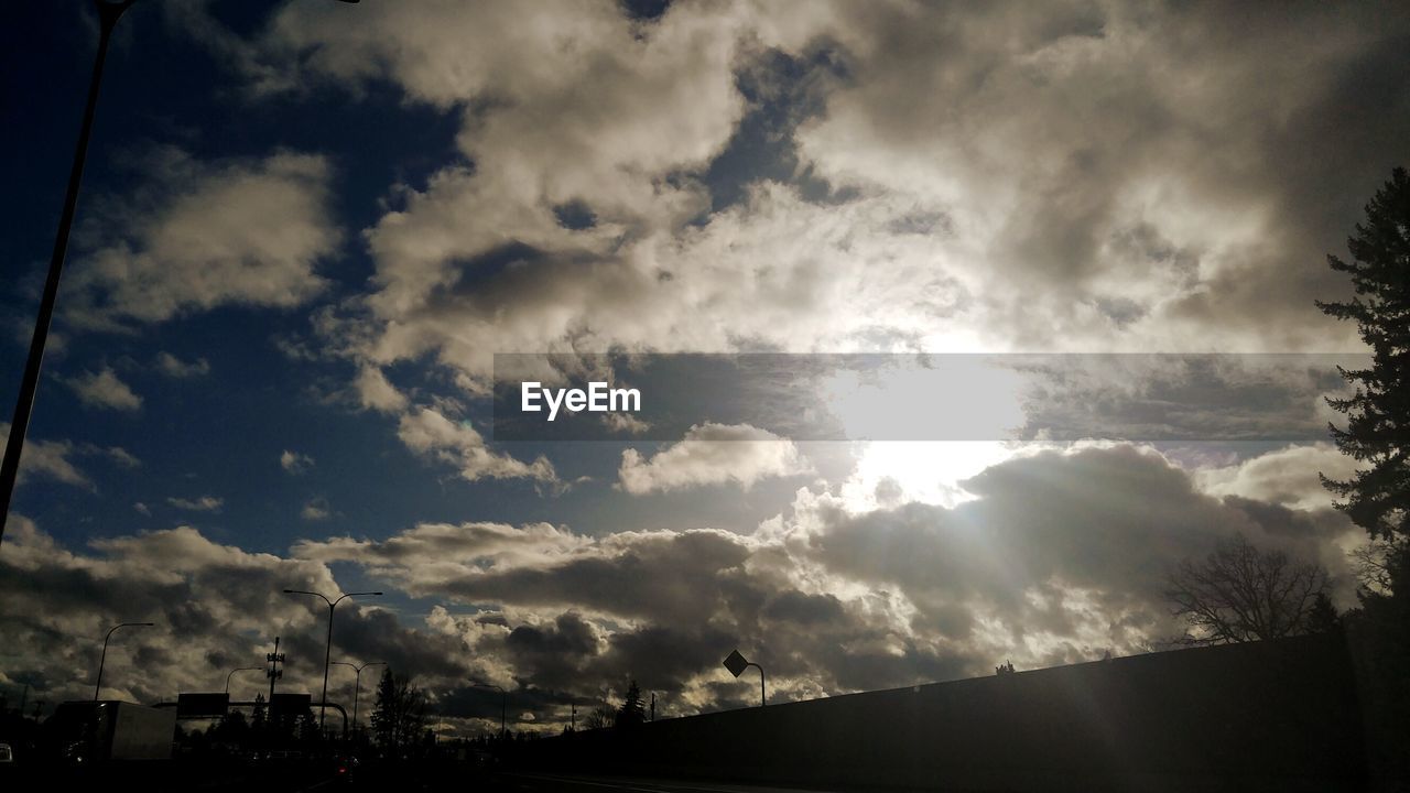 LOW ANGLE VIEW OF CLOUDY SKY AT SUNSET