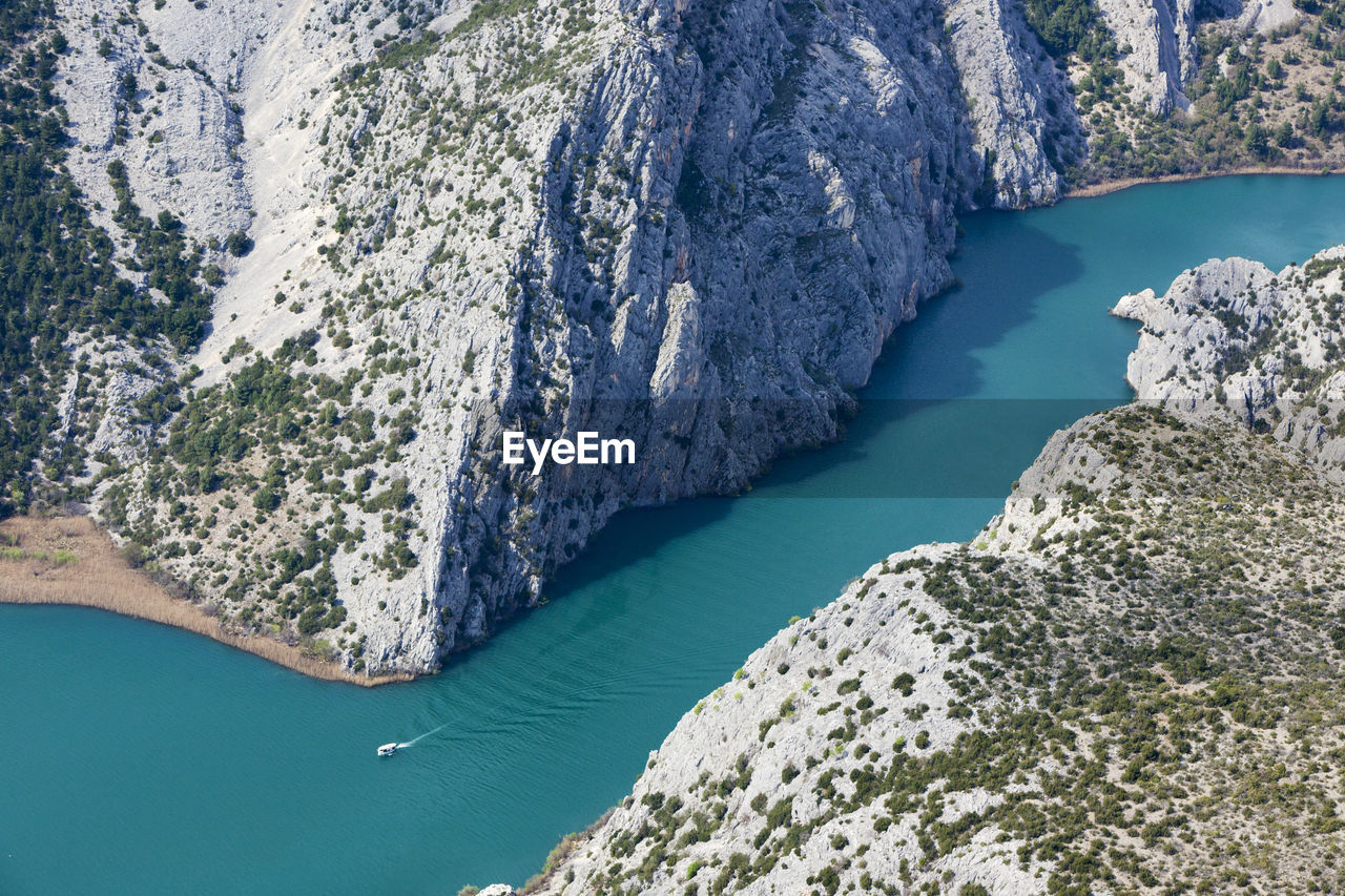 High angle view of rocks by sea