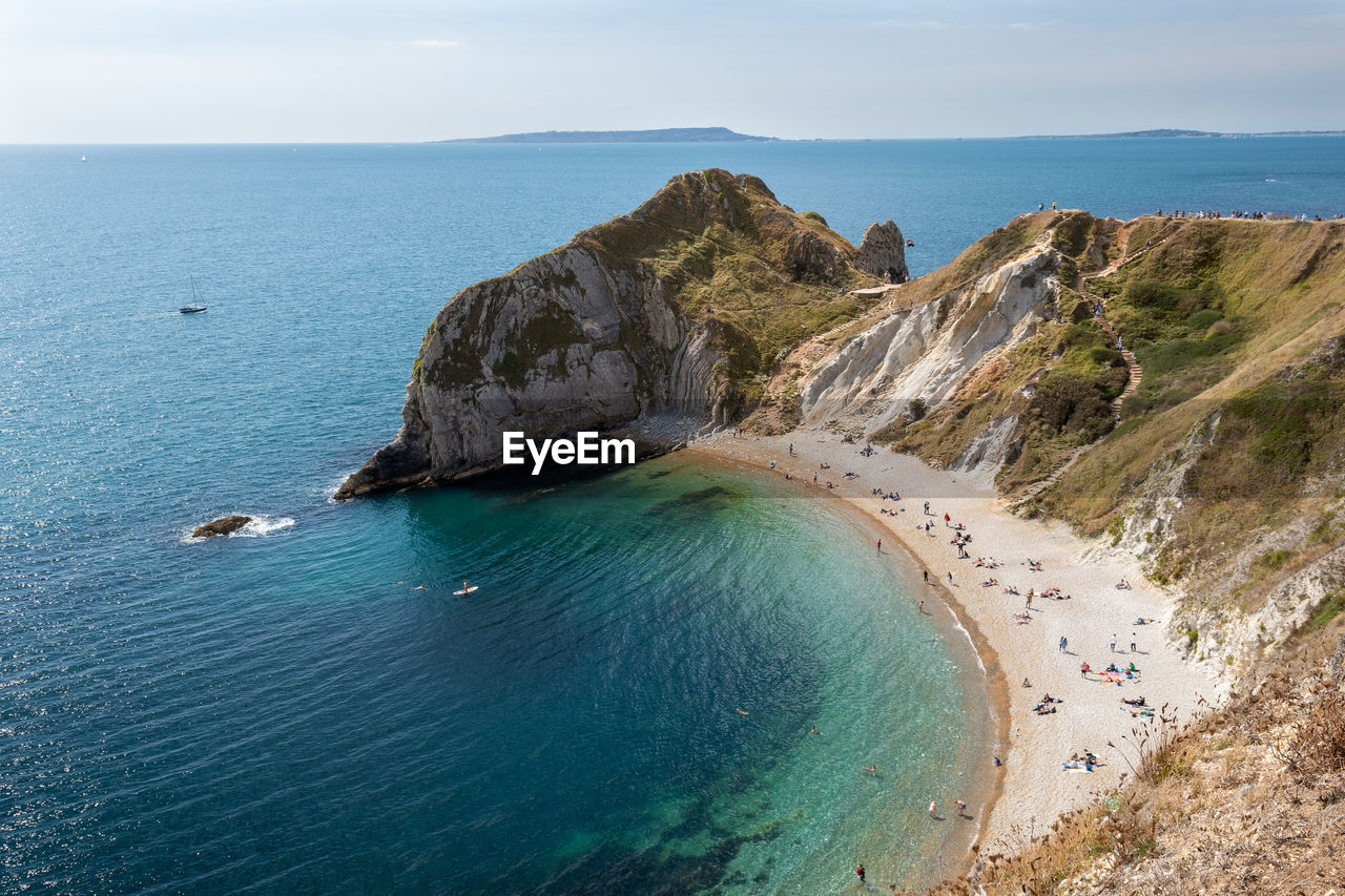 HIGH ANGLE VIEW OF BEACH AGAINST SKY