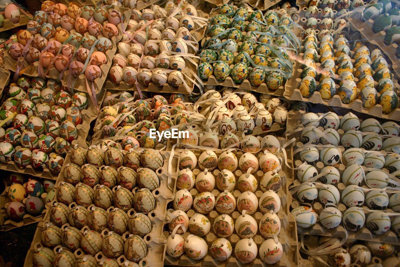 High angle view of easter eggs arranged on carton in store