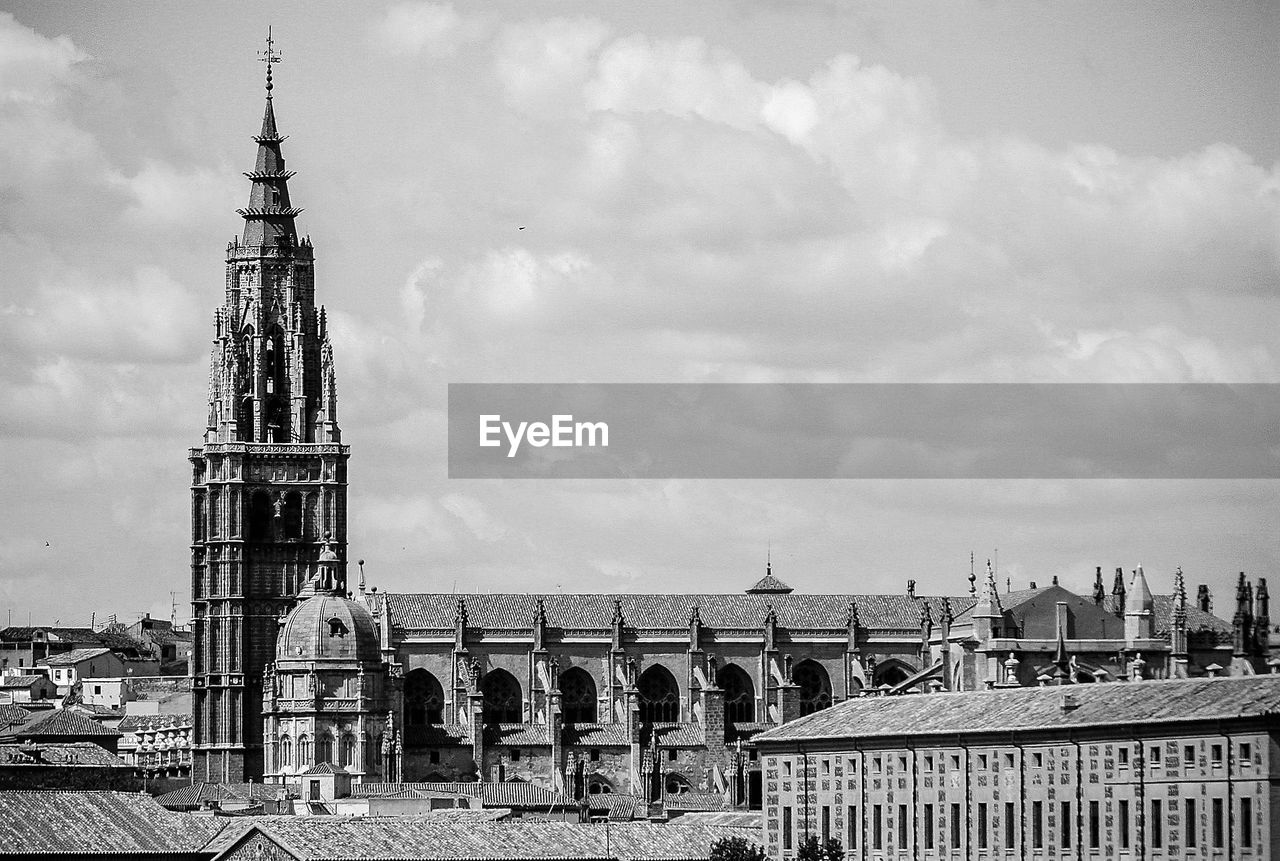 VIEW OF BUILT STRUCTURE AGAINST CLOUDY SKY