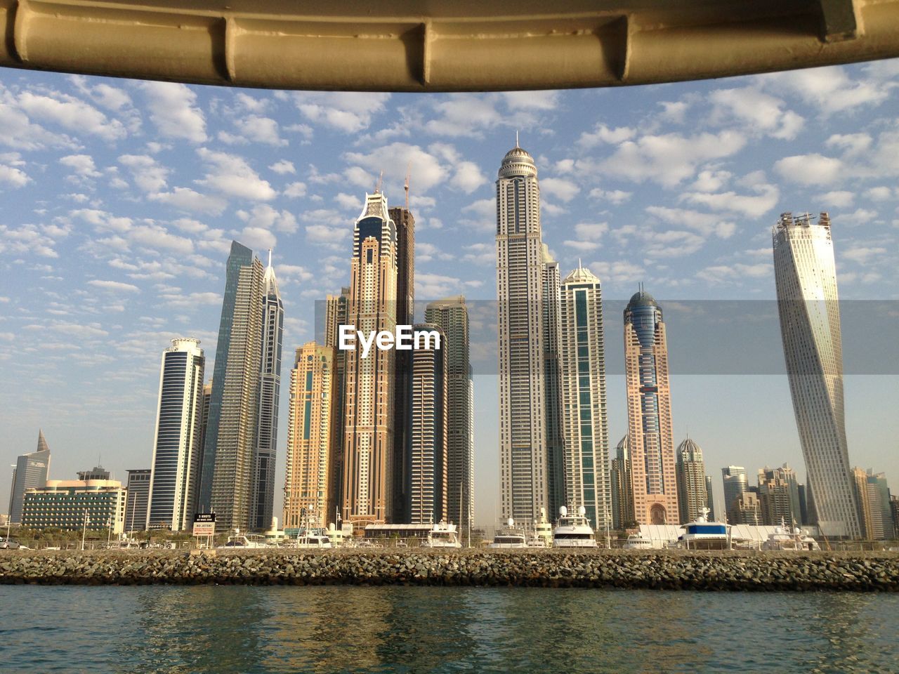 Skyscrapers at dubai marina against sky