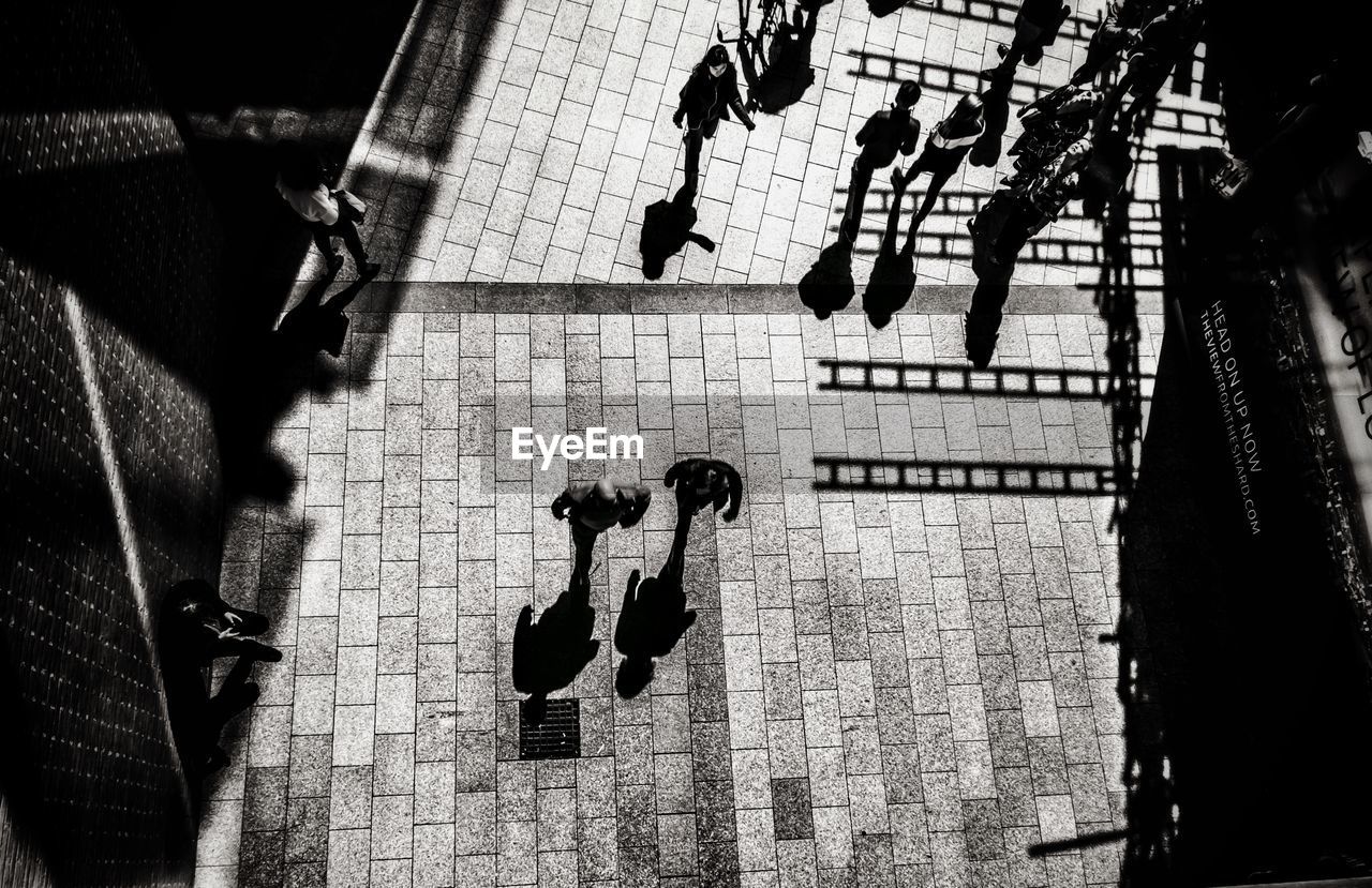 High angle view of people walking on street