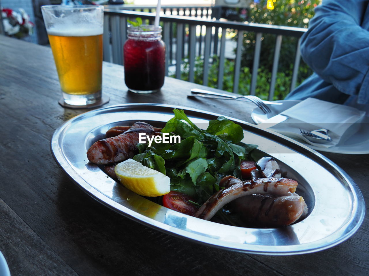 CLOSE-UP OF DRINK SERVED ON TABLE WITH BEER