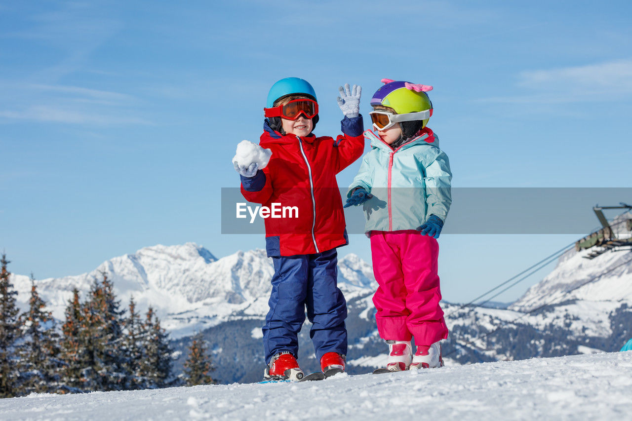 rear view of man skiing on snowcapped mountain