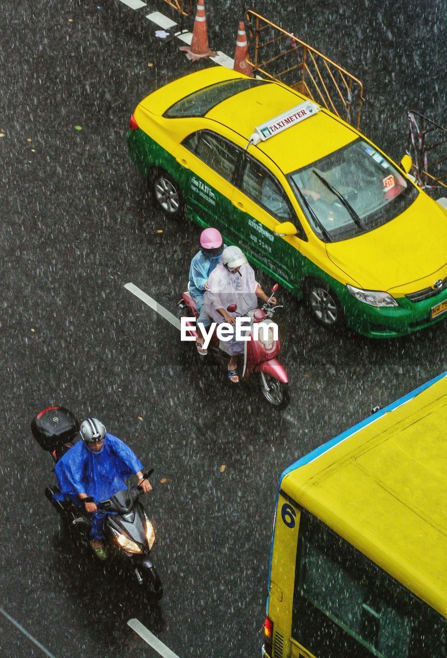 HIGH ANGLE VIEW OF PEOPLE ON STREET