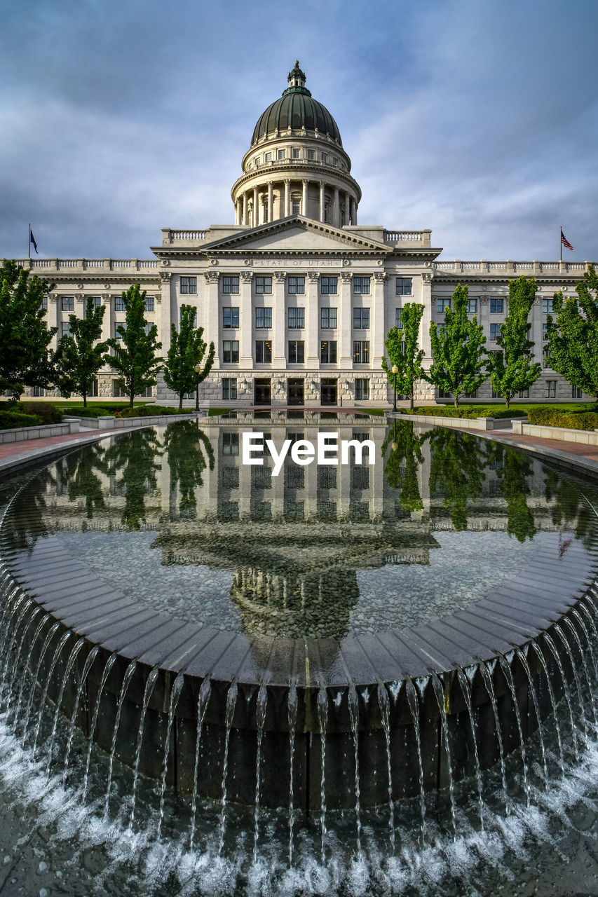 architecture, built structure, landmark, government, travel destinations, building exterior, water, dome, reflection, nature, sky, politics and government, water feature, travel, city, fountain, tourism, politics, palace, plant, history, no people, building, the past, cloud, reflecting pool, outdoors, day, tree