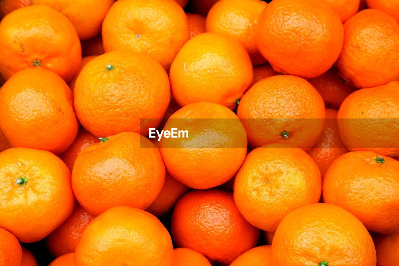 Full frame shot of oranges in market