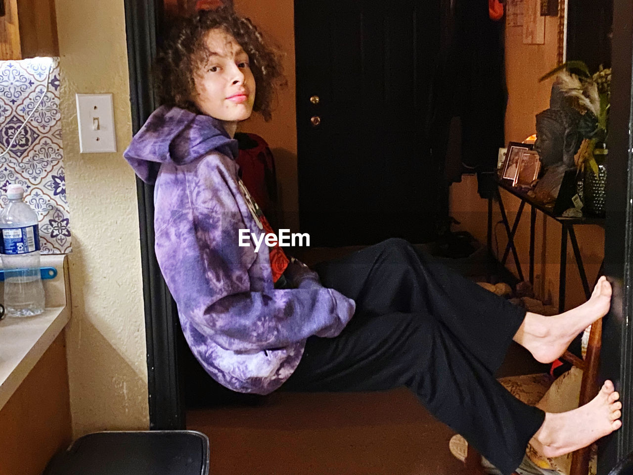 Portrait of young man sitting  at home