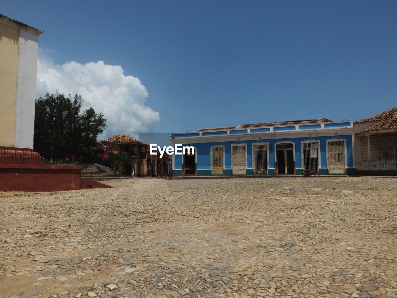 BUILT STRUCTURES AGAINST BLUE SKY AND CLOUDS