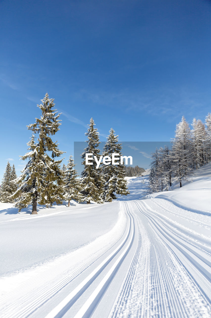 Cross-country ski trail in the austrian alps. winter sport concept