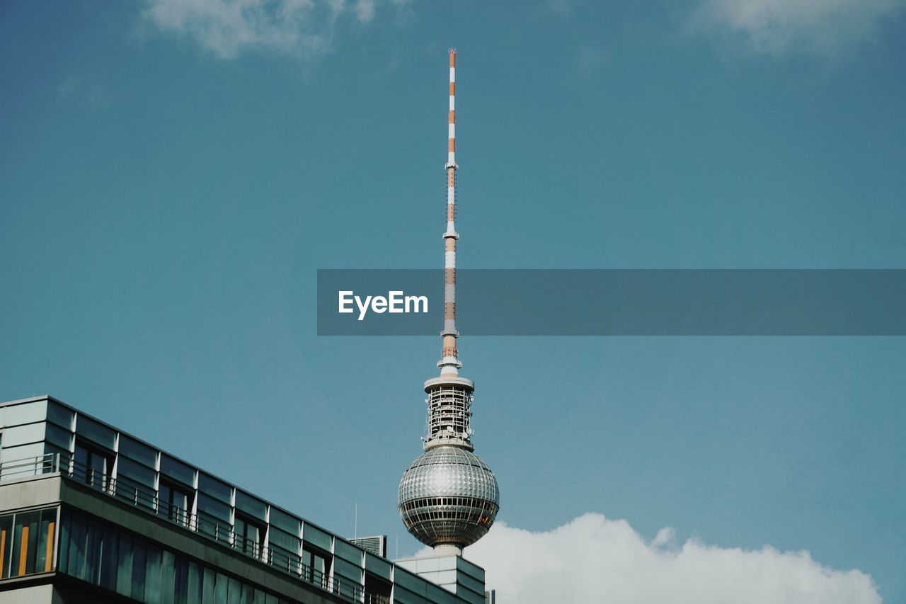 Low angle view of fernsehturm tower against sky