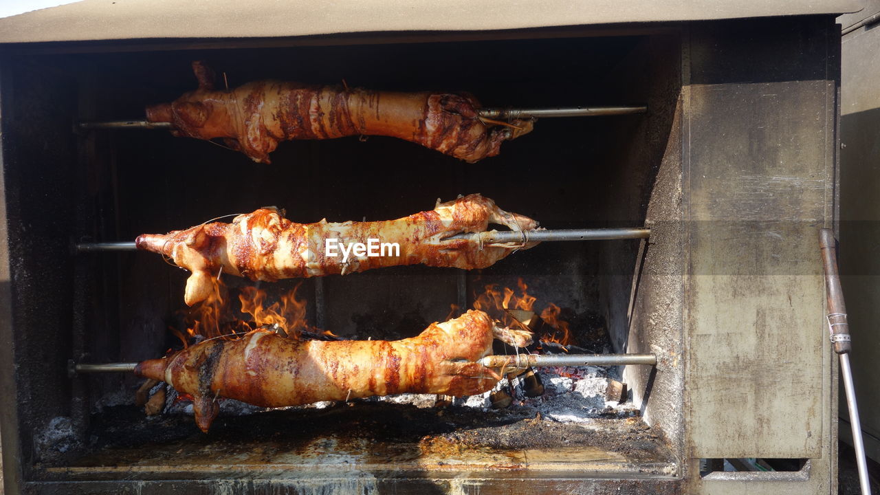 High angle view of roast pork on barbecue