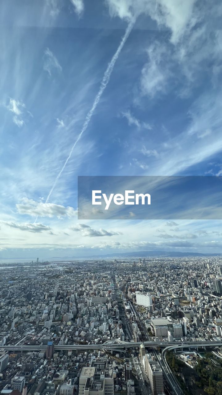 architecture, city, sky, horizon, built structure, building exterior, cityscape, cloud, building, aerial photography, nature, skyscraper, aerial view, residential district, skyline, landscape, high angle view, no people, travel destinations, city life, outdoors, office building exterior, urban skyline, day, urban area, transportation, residential area, travel, blue, horizon over land