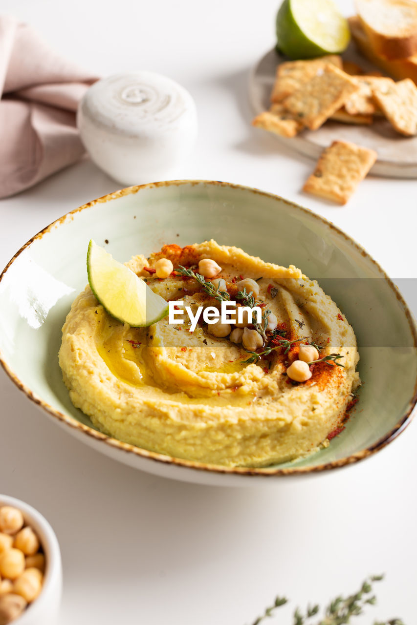 Classic hummus with spices and lime in a bowl