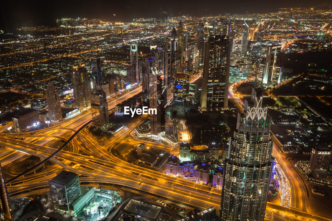 High angle view of illuminated cityscape at night