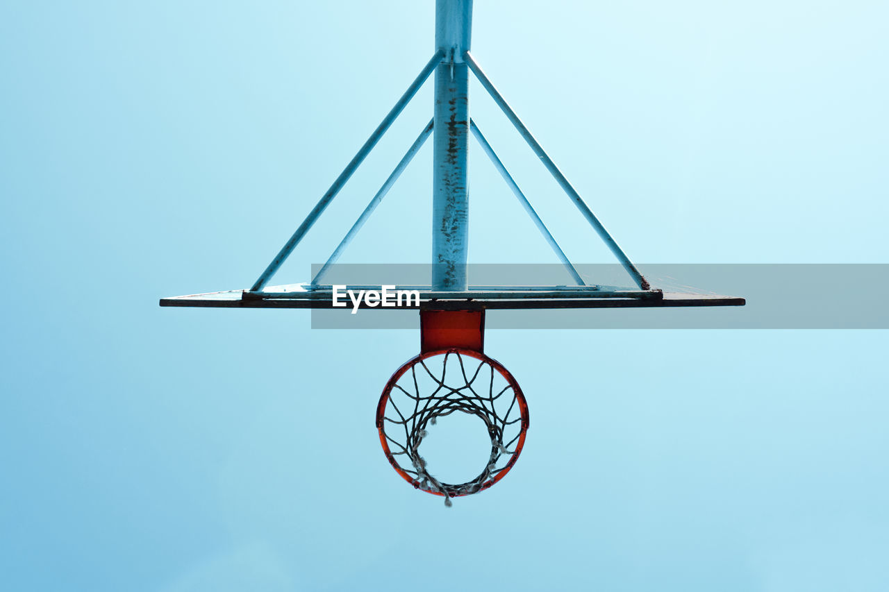 low angle view of basketball hoop against blue sky