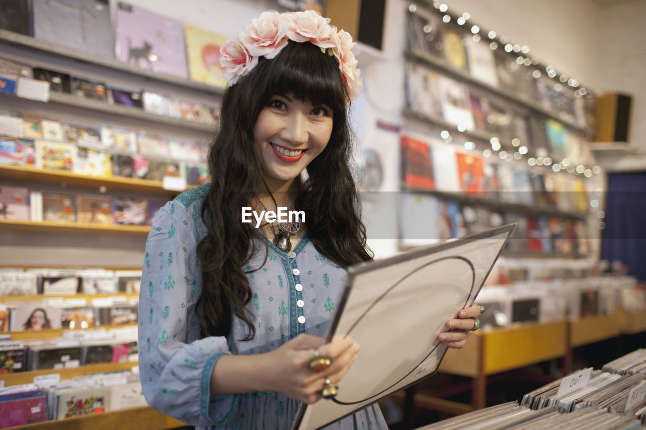 Young woman browsing albums in a record store