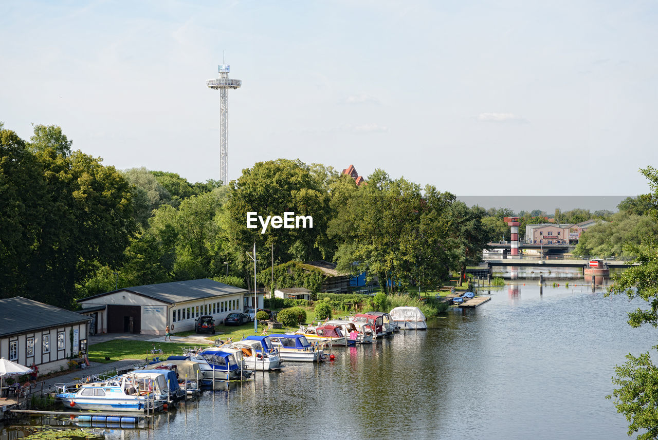 Boats moored in river