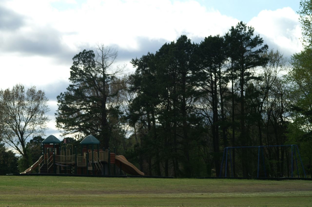 BUILT STRUCTURE WITH TREES IN FOREGROUND