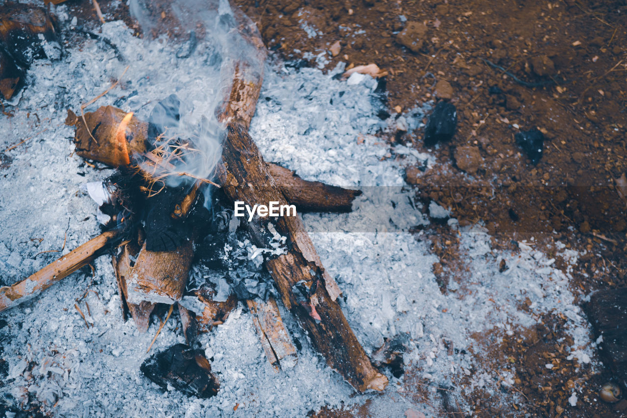 High angle view of campfire on field