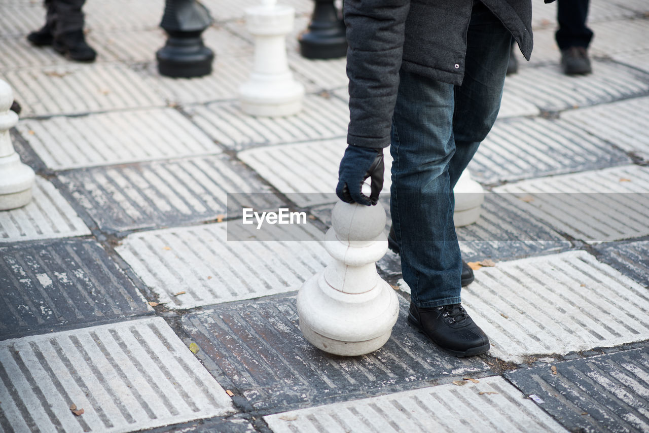 Low section of man on sidewalk