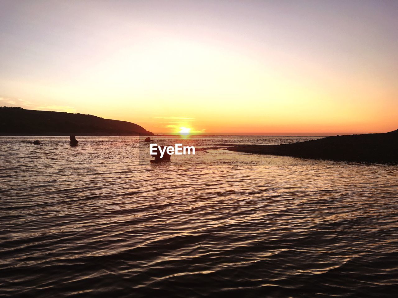 Scenic view of sea against sky during sunset