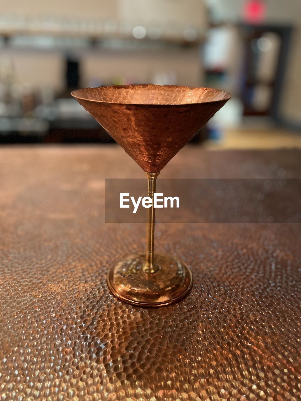 CLOSE-UP OF BEER IN GLASS ON TABLE