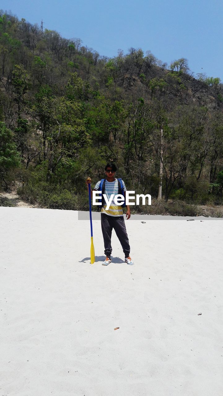 Full length of man standing at beach