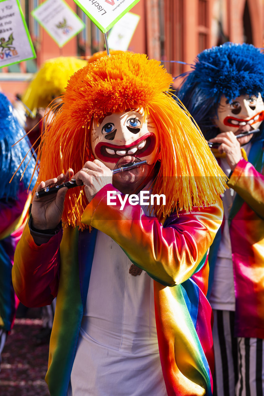 People wearing costumes during carnival