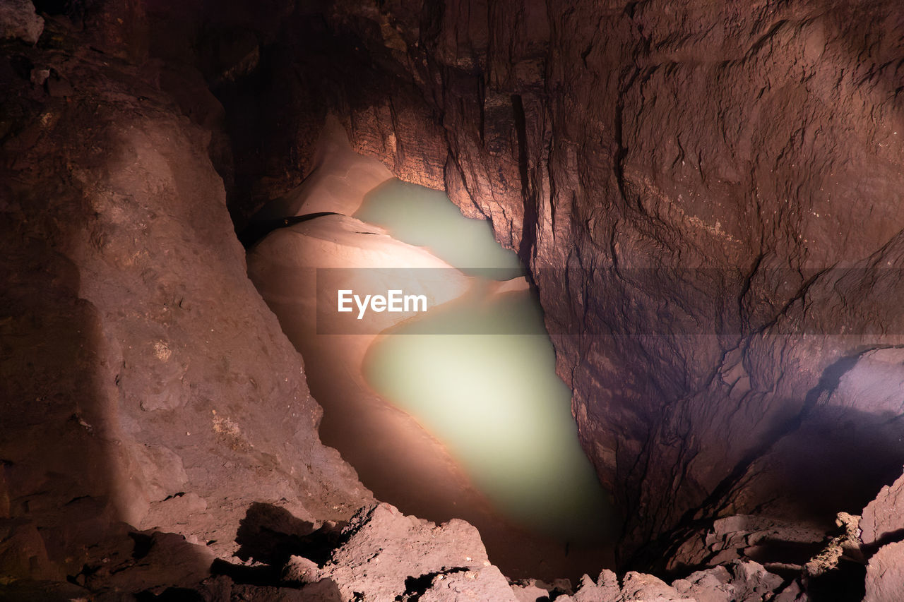 cropped image of woman standing by rock