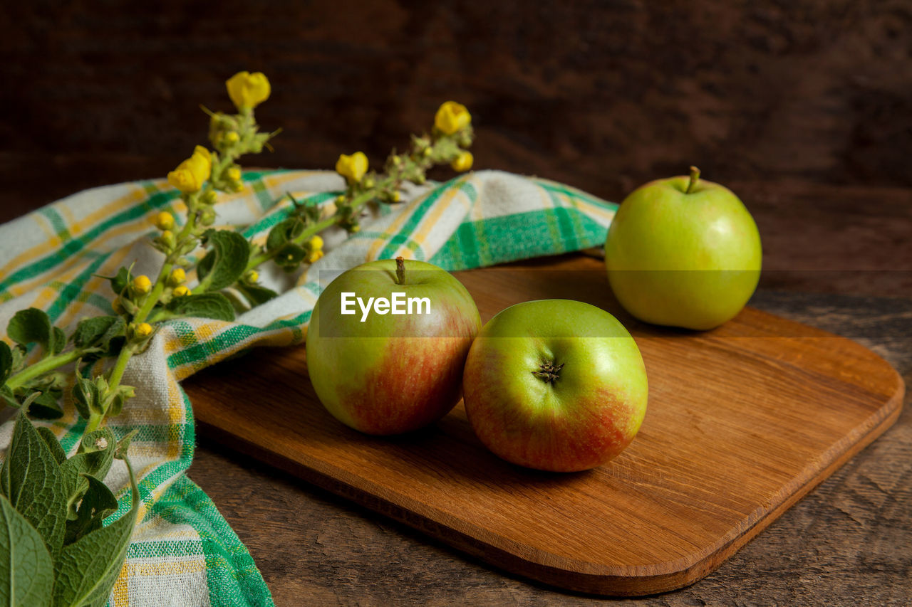 high angle view of apples on wooden table