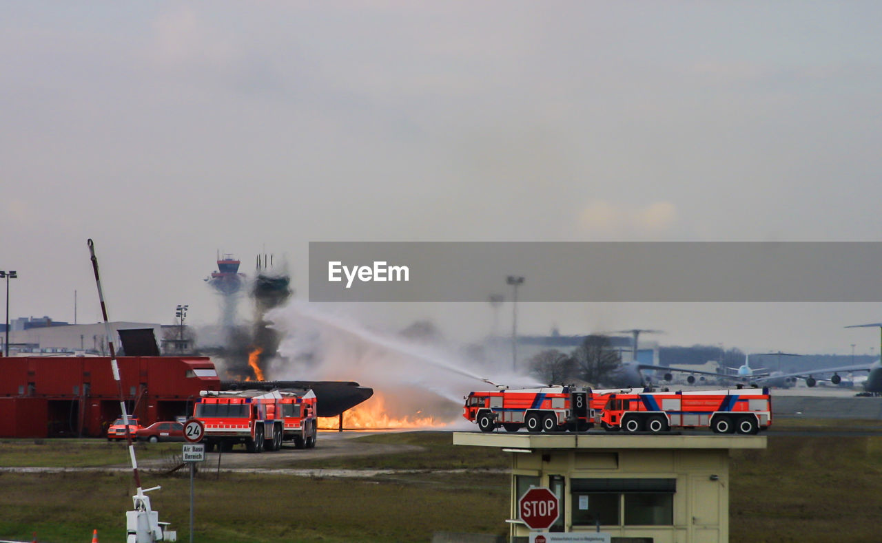 TRAIN AGAINST SKY ON RUNWAY