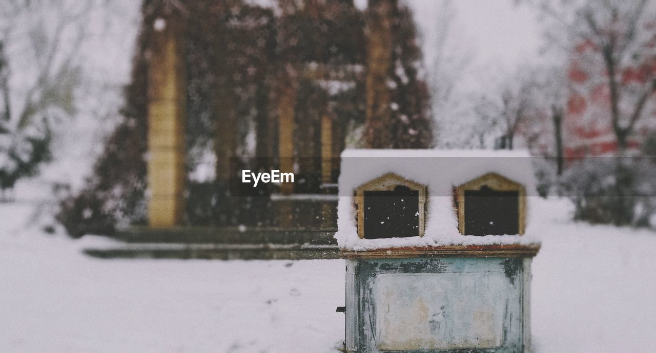 CLOSE-UP OF SNOW COVERED LAND ON FIELD