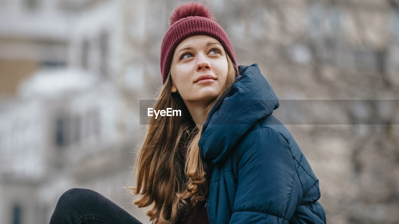 PORTRAIT OF BEAUTIFUL WOMAN IN SNOW