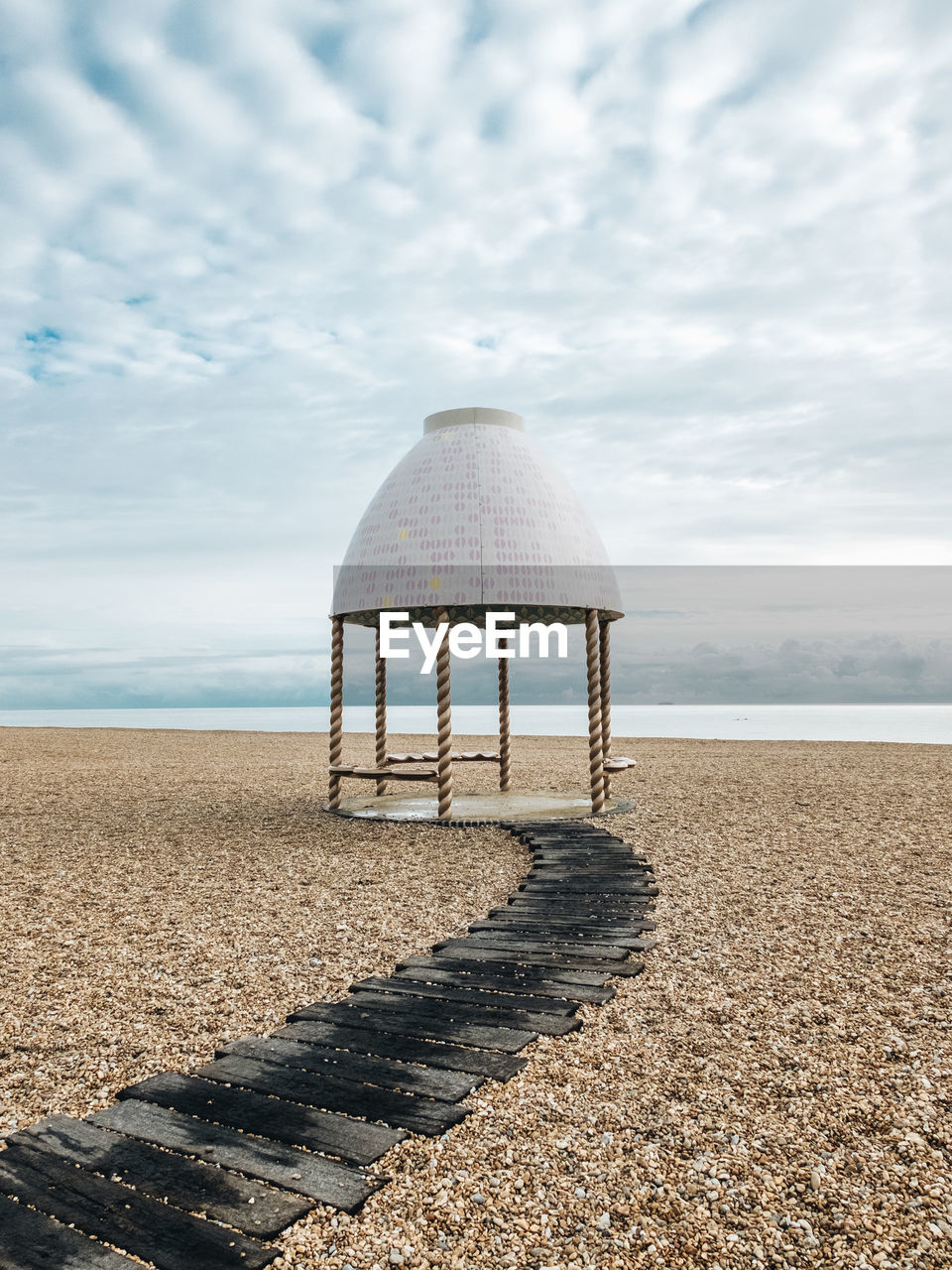 GAZEBO AT BEACH AGAINST SKY