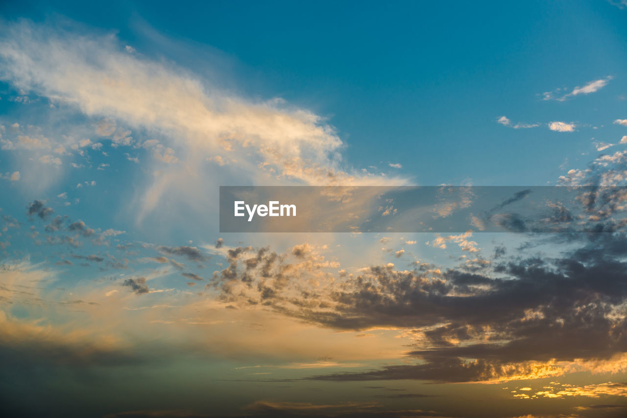 Low angle view of cloudy sky during sunset