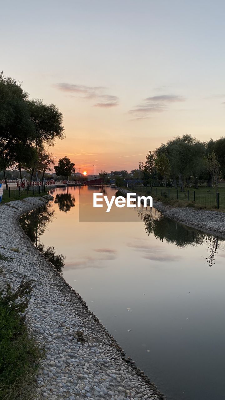 SCENIC VIEW OF LAKE DURING SUNSET