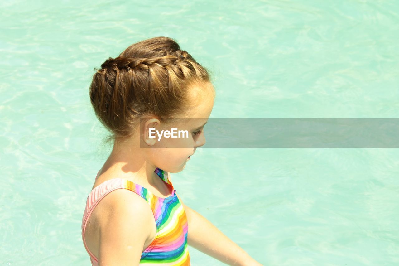 High angle view of girl in swimming pool.