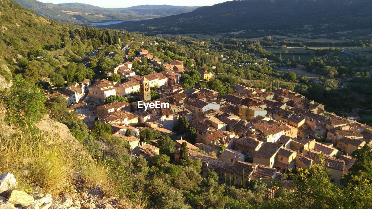 High angle view of houses in community with trees