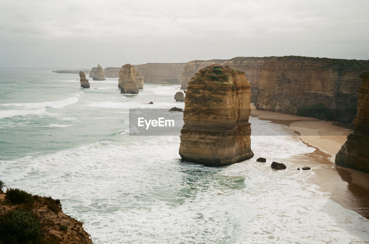 Rock formation on beach against sky, the twelve apostles in melbourne