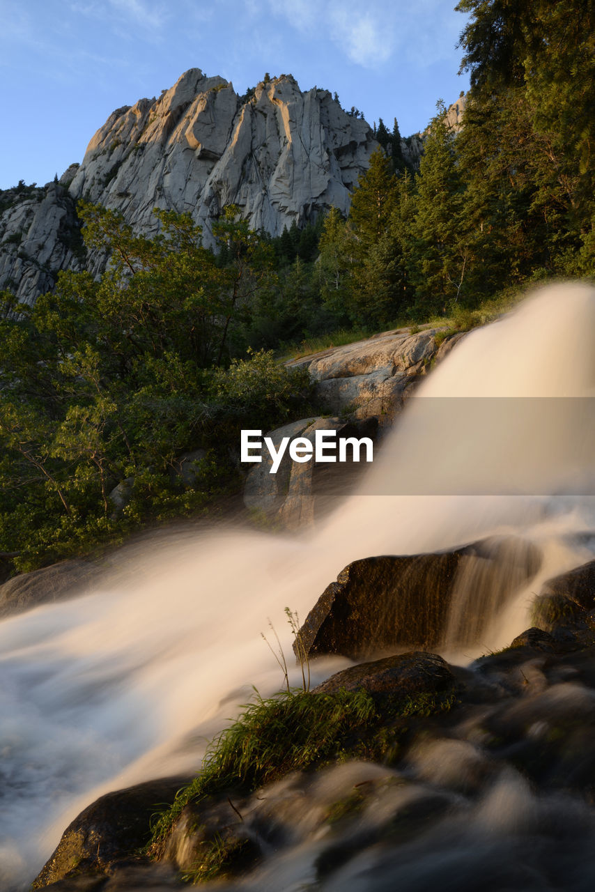 Evening light and waterfall below west bell tower in the wasatch mtns.