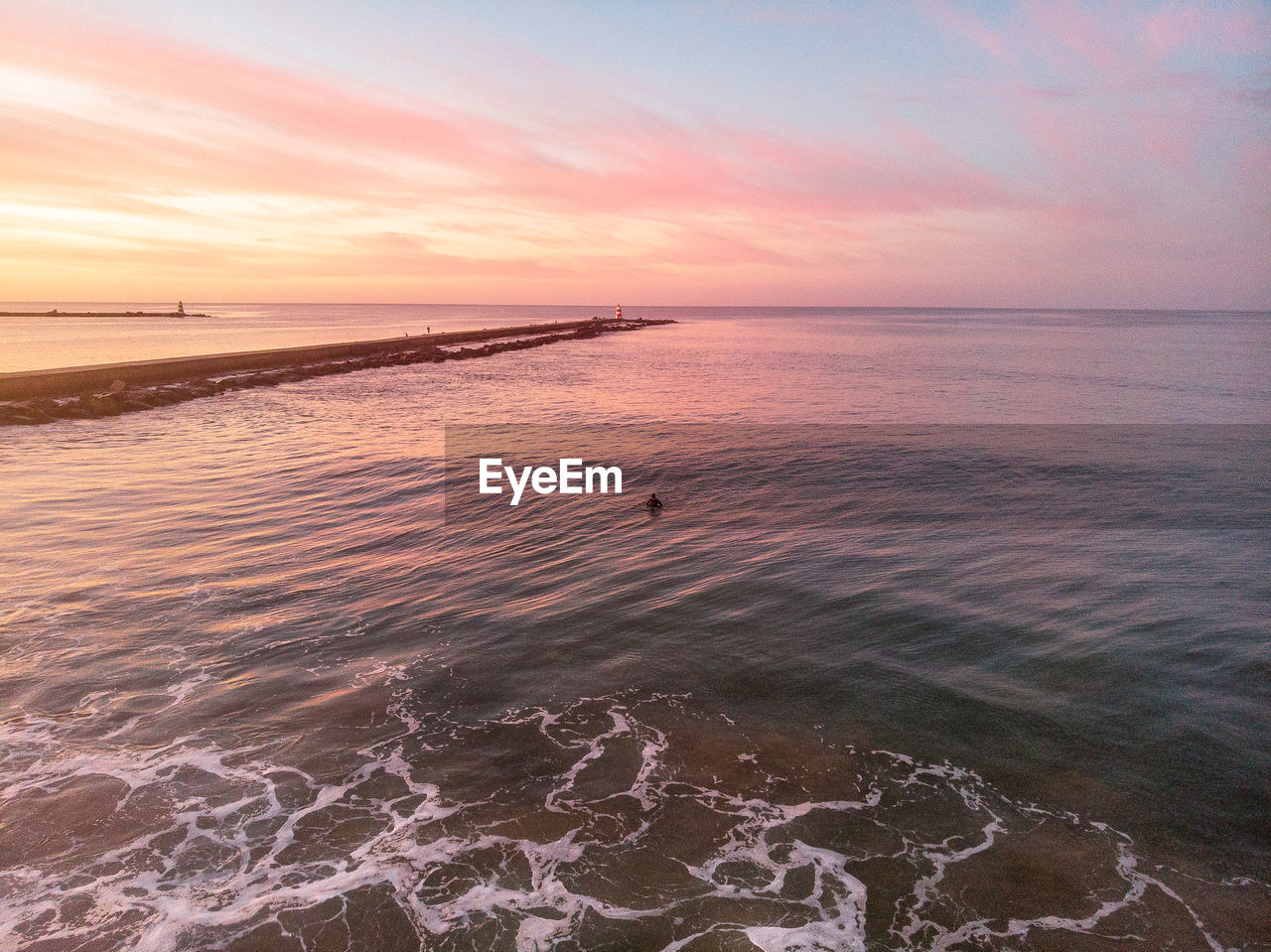 Scenic view of sea against sky during sunset