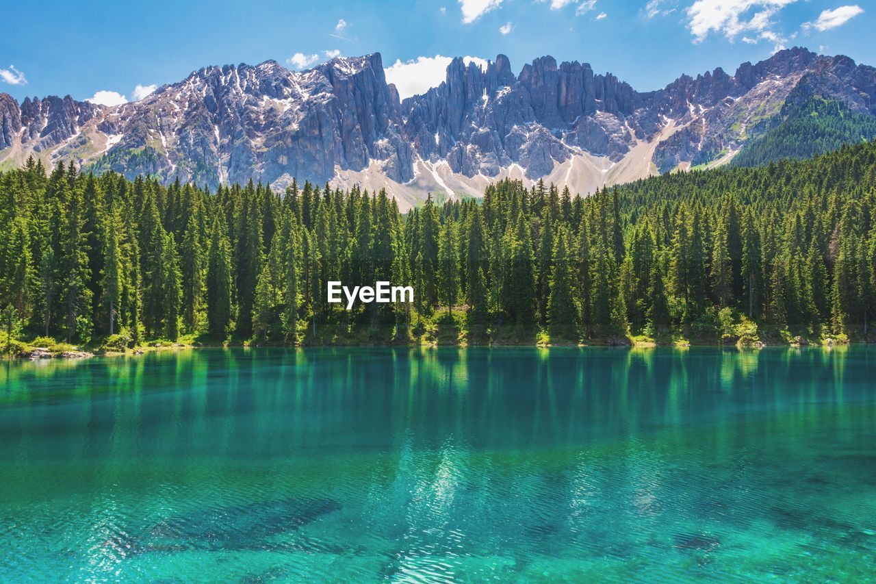 Scenic view of lake with mountains in background