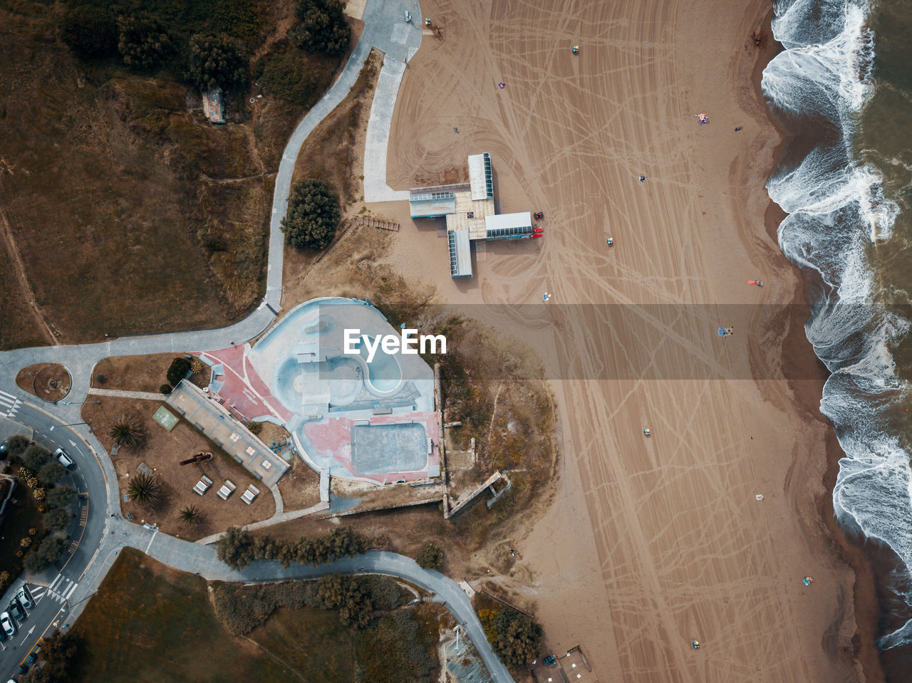 HIGH ANGLE VIEW OF CONSTRUCTION SITE ON BEACH