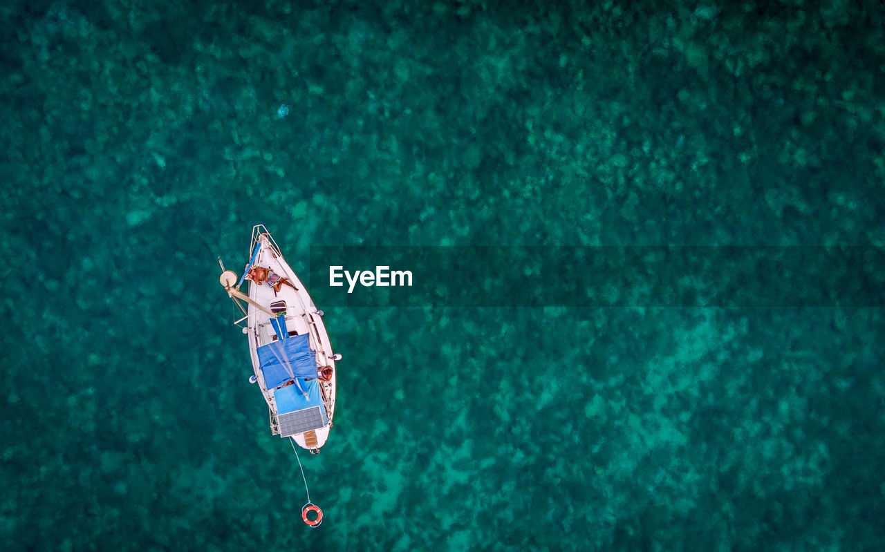 Directly above shot of man in boat on sea