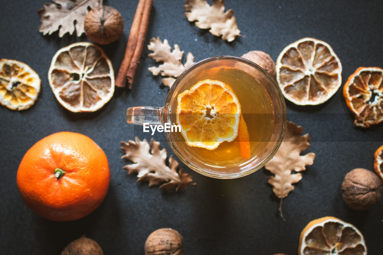 food and drink, food, orange, fruit, healthy eating, citrus fruit, orange color, wellbeing, freshness, directly above, high angle view, ingredient, no people, studio shot, cinnamon, produce, still life, indoors, star anise, spice, cross section, variation, wood, slice, nut - food, nature, nut, plant, tangerine, clove, table