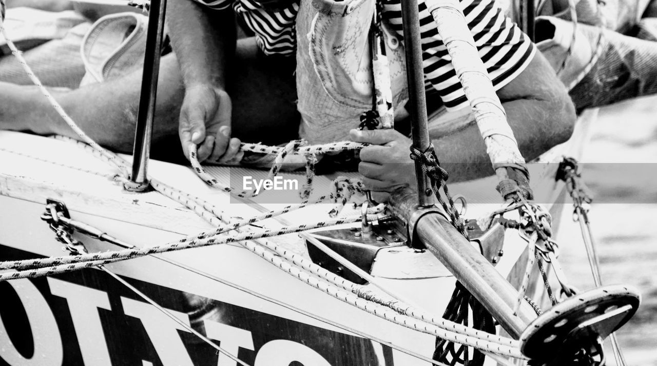 LOW SECTION OF PERSON WITH BICYCLE ON ZEBRA