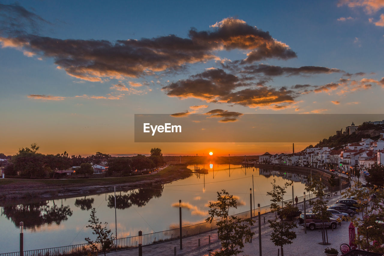 Scenic view of lake against sky during sunset