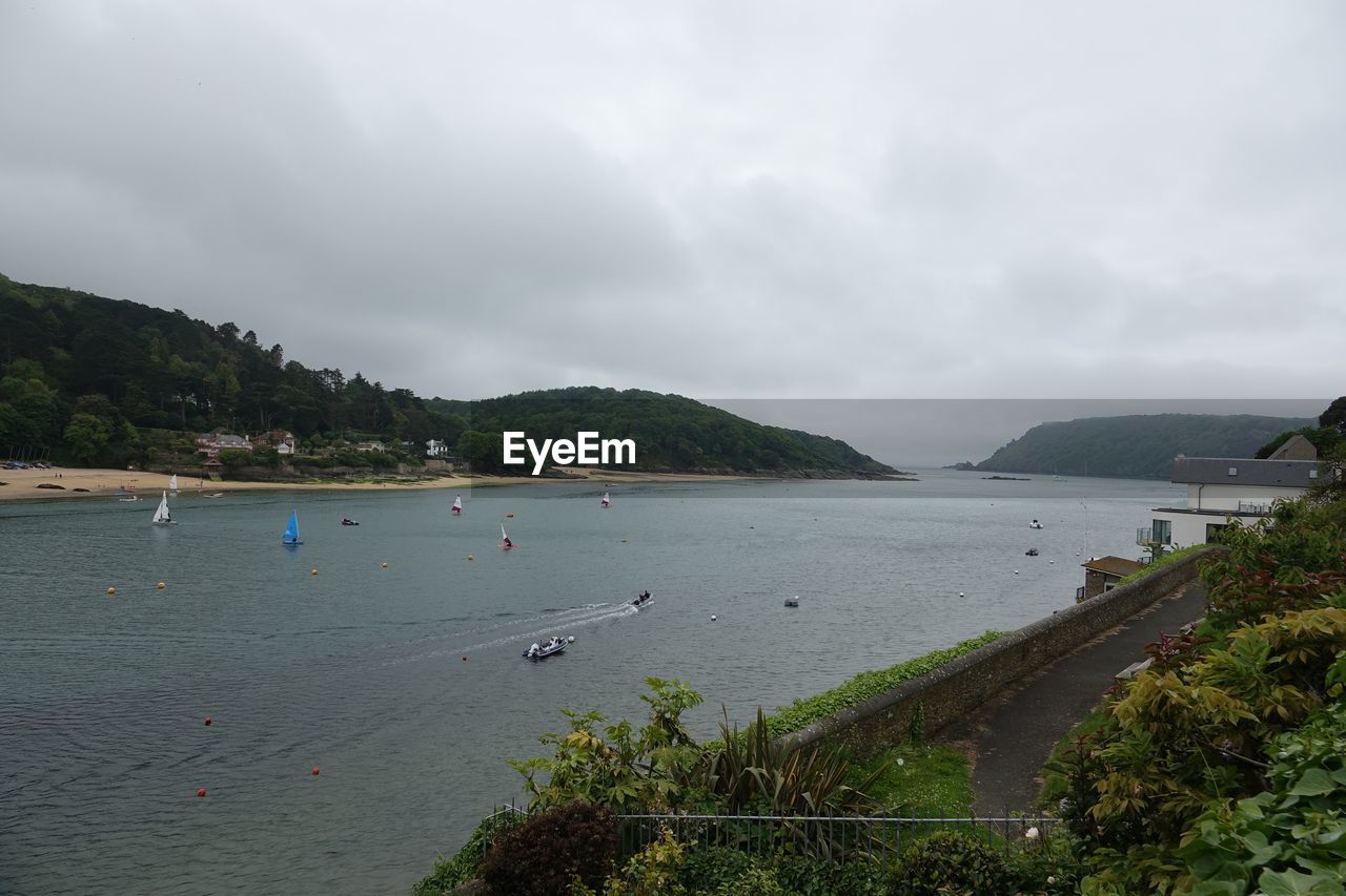 Scenic view of bay against sky